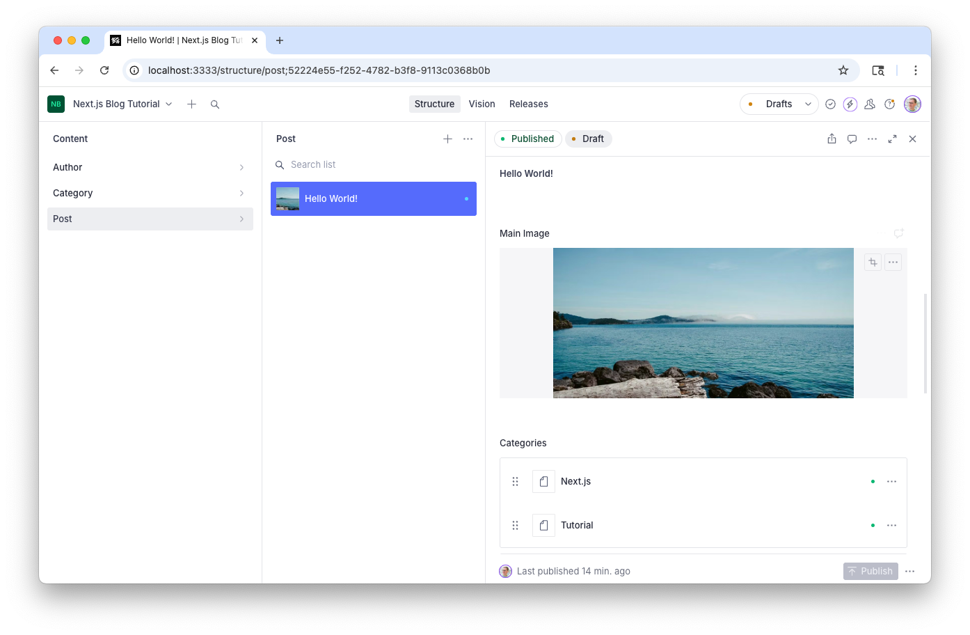 A content management system editing a "Hello World!" blog post, showing a coastline image and categories Next.js, Tutorial.