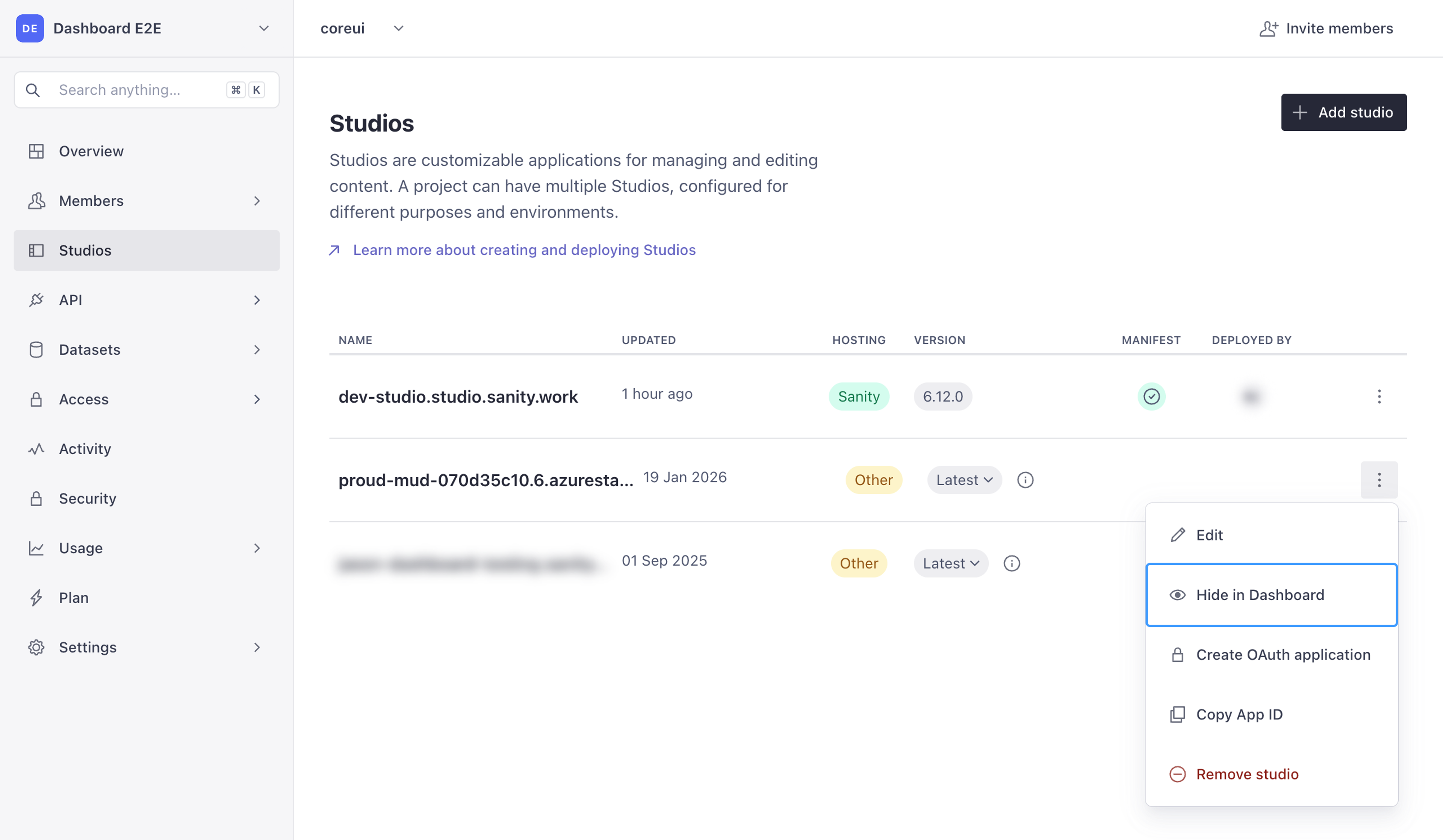 The project's Studios page in Sanity Manage, with Studios selected in the sidebar and a studio's context menu open on Hide in Dashboard.