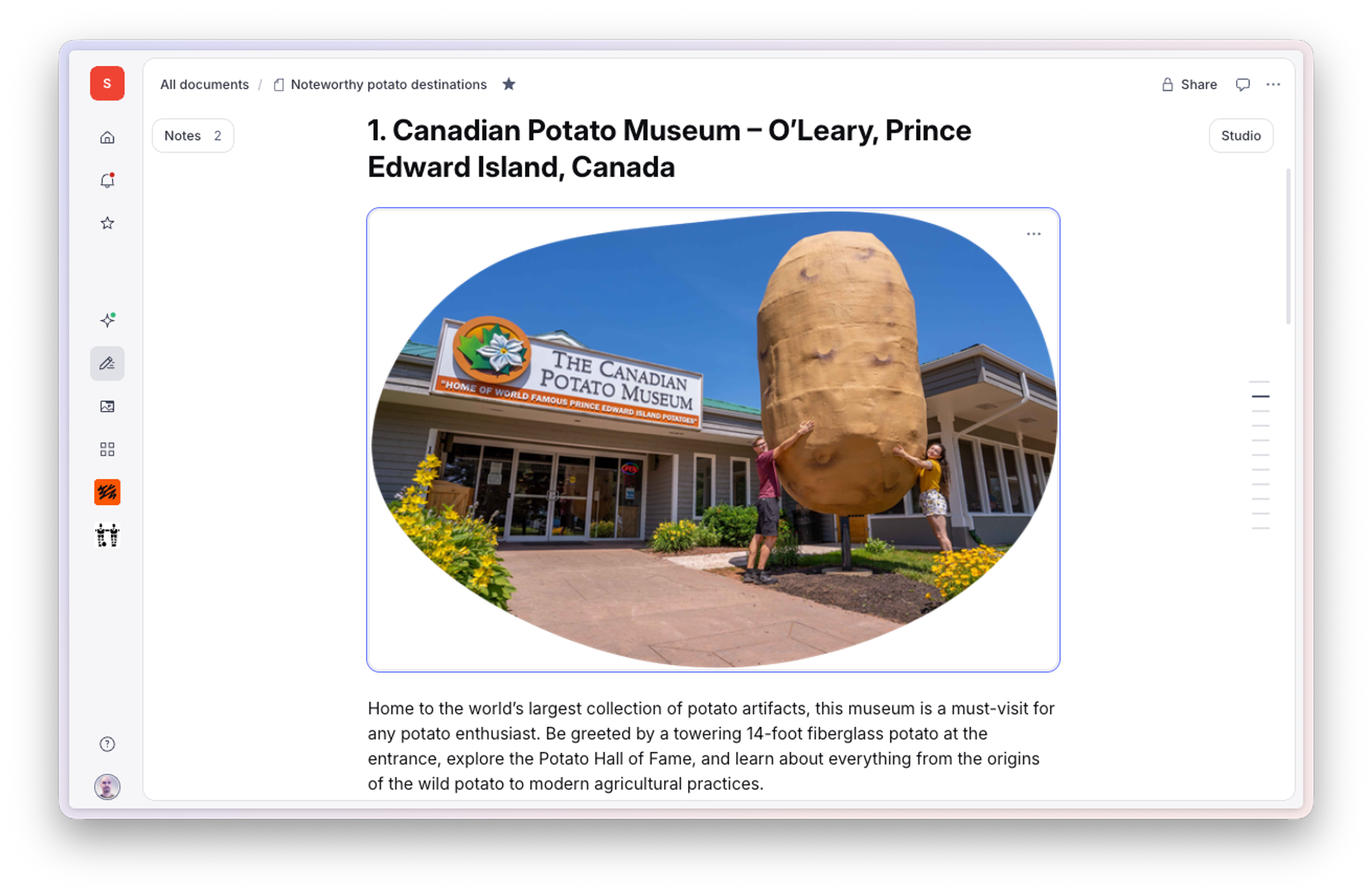 Exterior of the Canadian Potato Museum with a giant potato statue and two people posing.