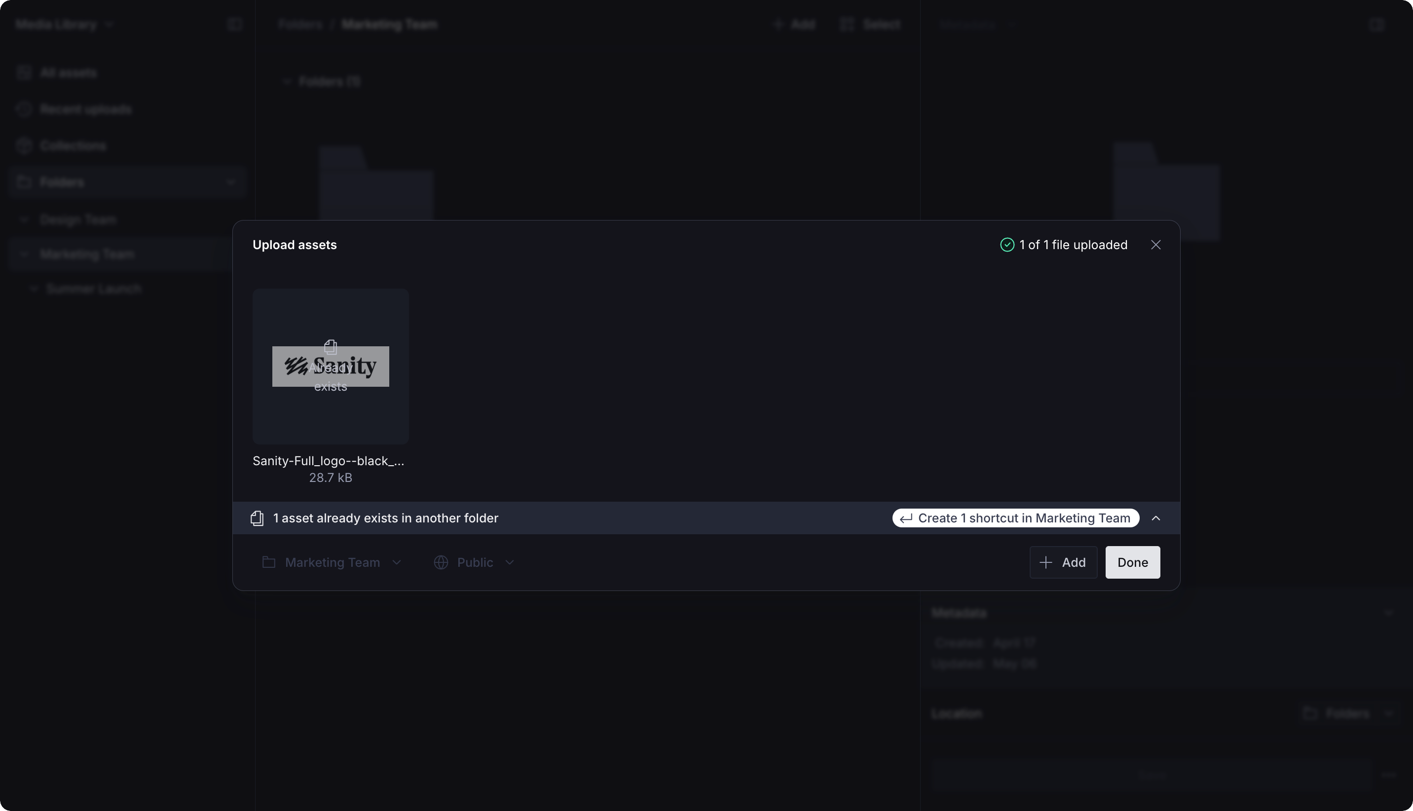 An "Upload assets" modal in a dark interface, showing a Sanity logo upload with "1 of 1 file uploaded" and an option to create a shortcut in "Marketing Team" for an existing asset.