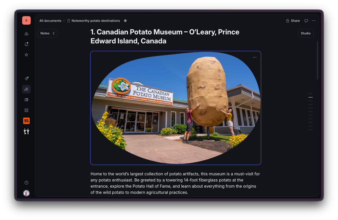Exterior of the Canadian Potato Museum with a giant potato statue and two people posing.
