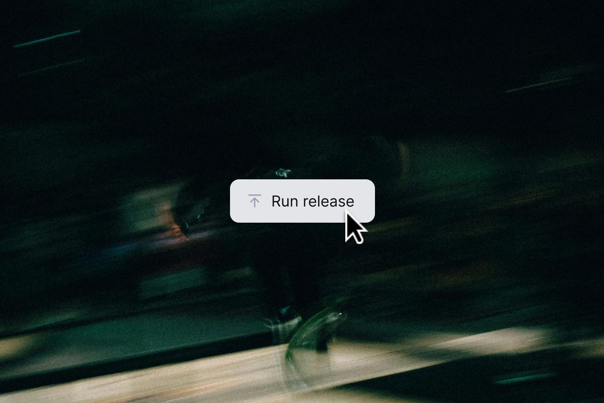 A mouse cursor points to a "Run release" button with an upward arrow, on a dark, motion-blurred background.