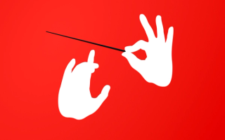 A pair of silhouette hands holding a conductors baton appearing to be conducting music.