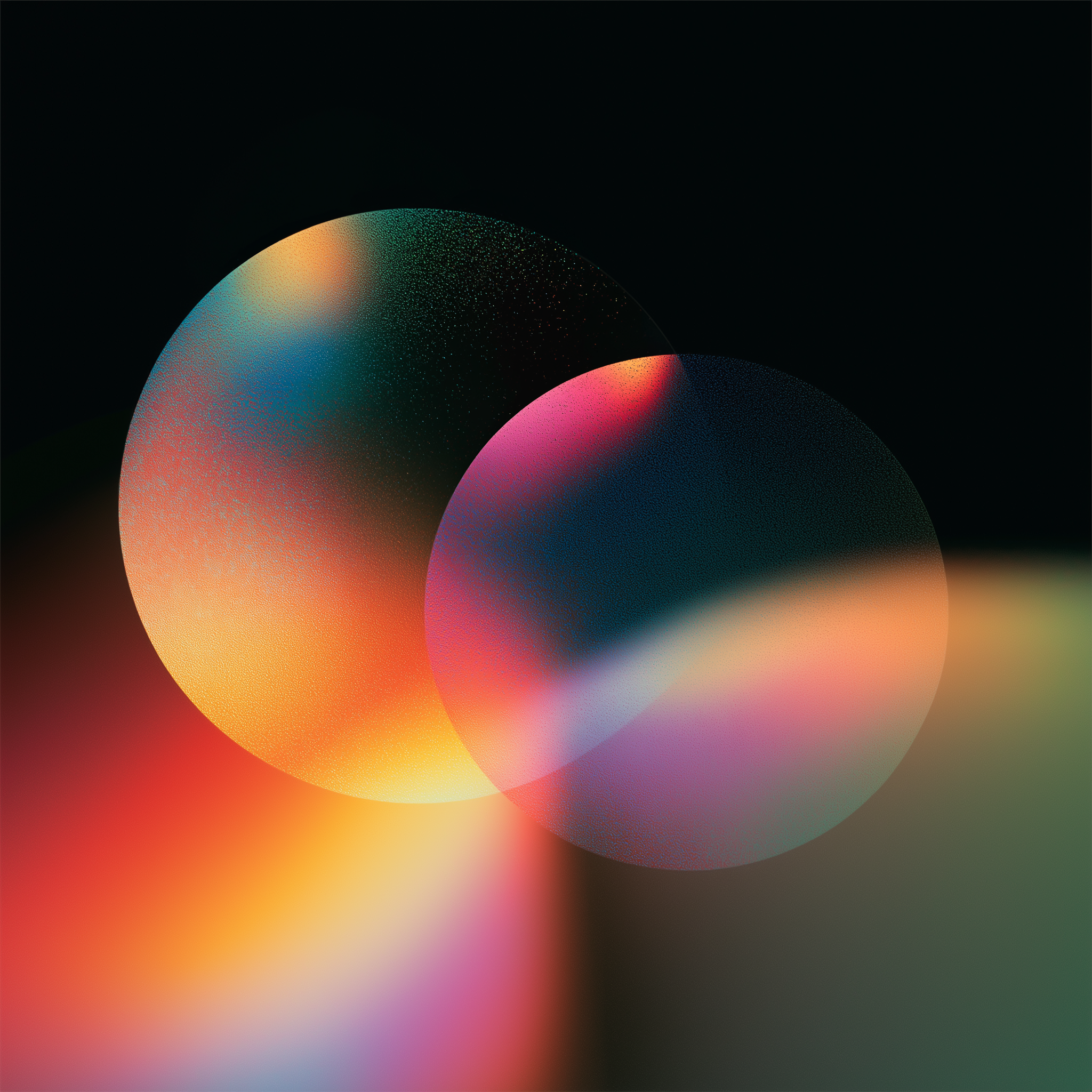 Abstract image of two overlapping, translucent circles with grainy color gradients on a dark background.