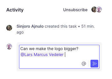 Shows a comment in a task thread tagging a team member with a @mention