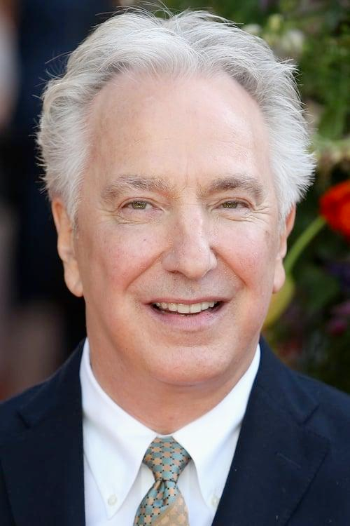 The late, great actor Alan Rickman smiling awkwardly at the camera
