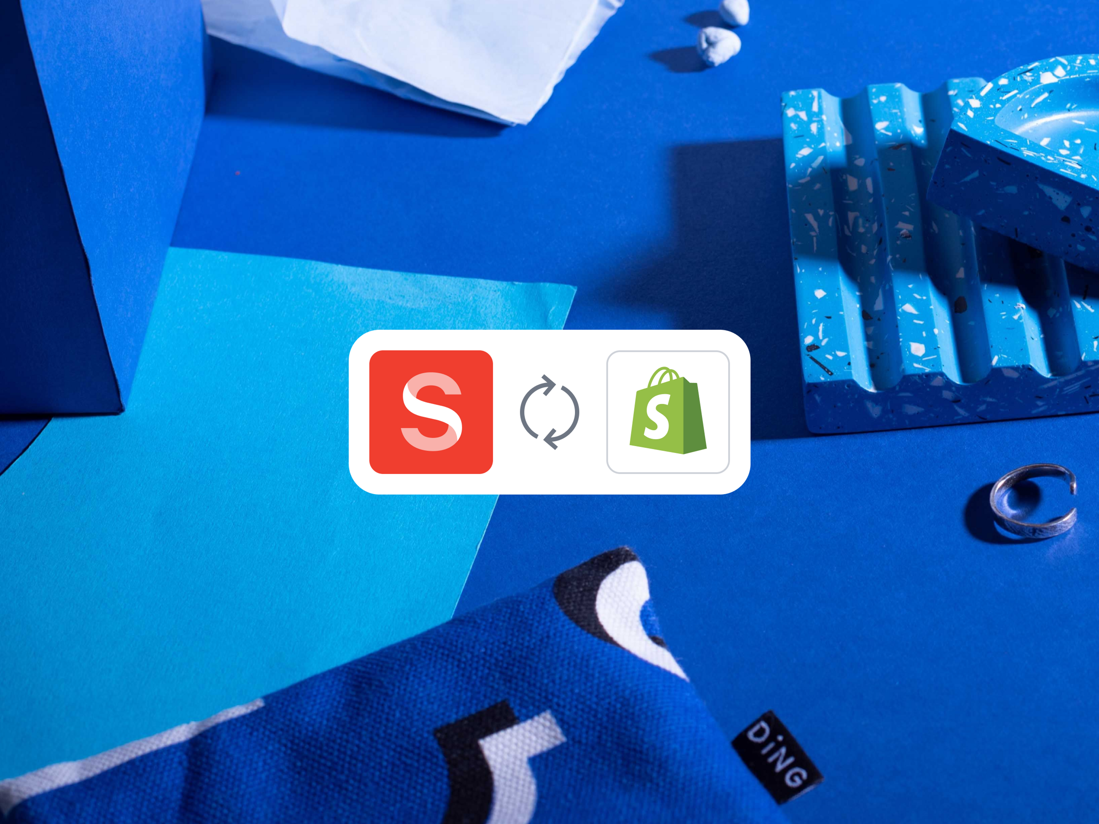 A poster image with Sanity and Shopify and an icon describing a two-way sync between the two products.