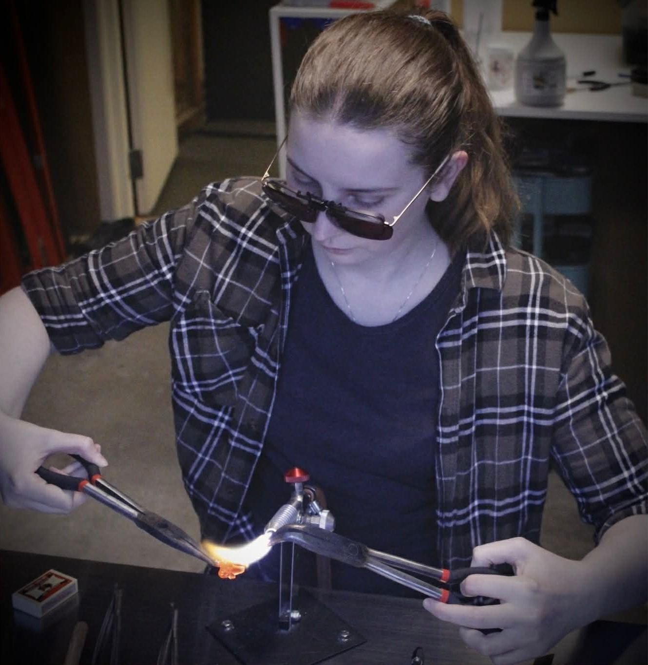 Portrait of glass artist Hanna Karlsen in her studio