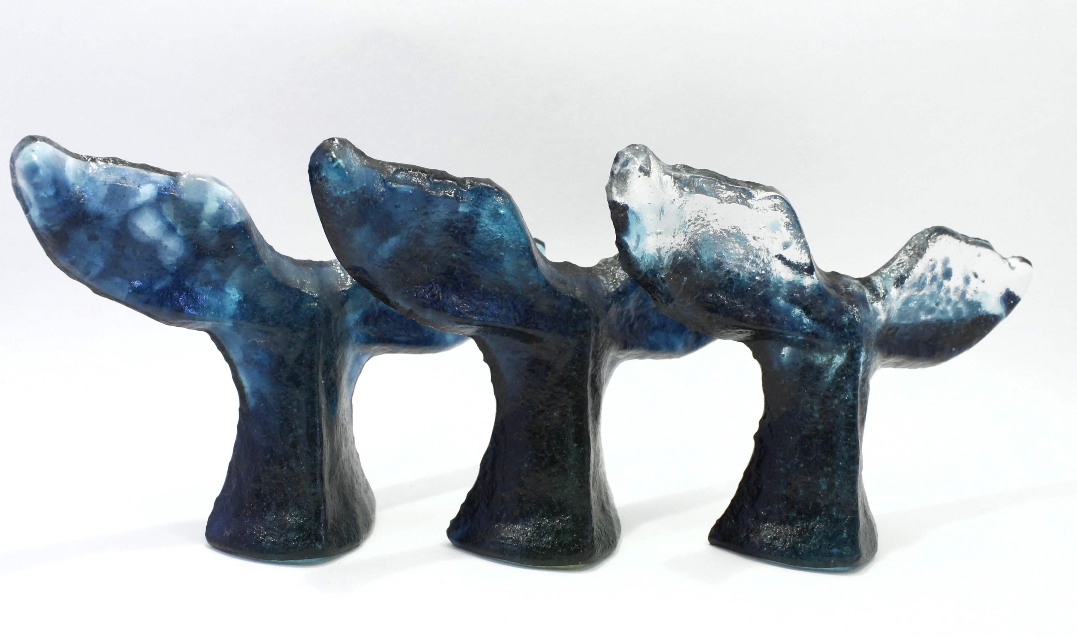 Three sculptures of whale tails