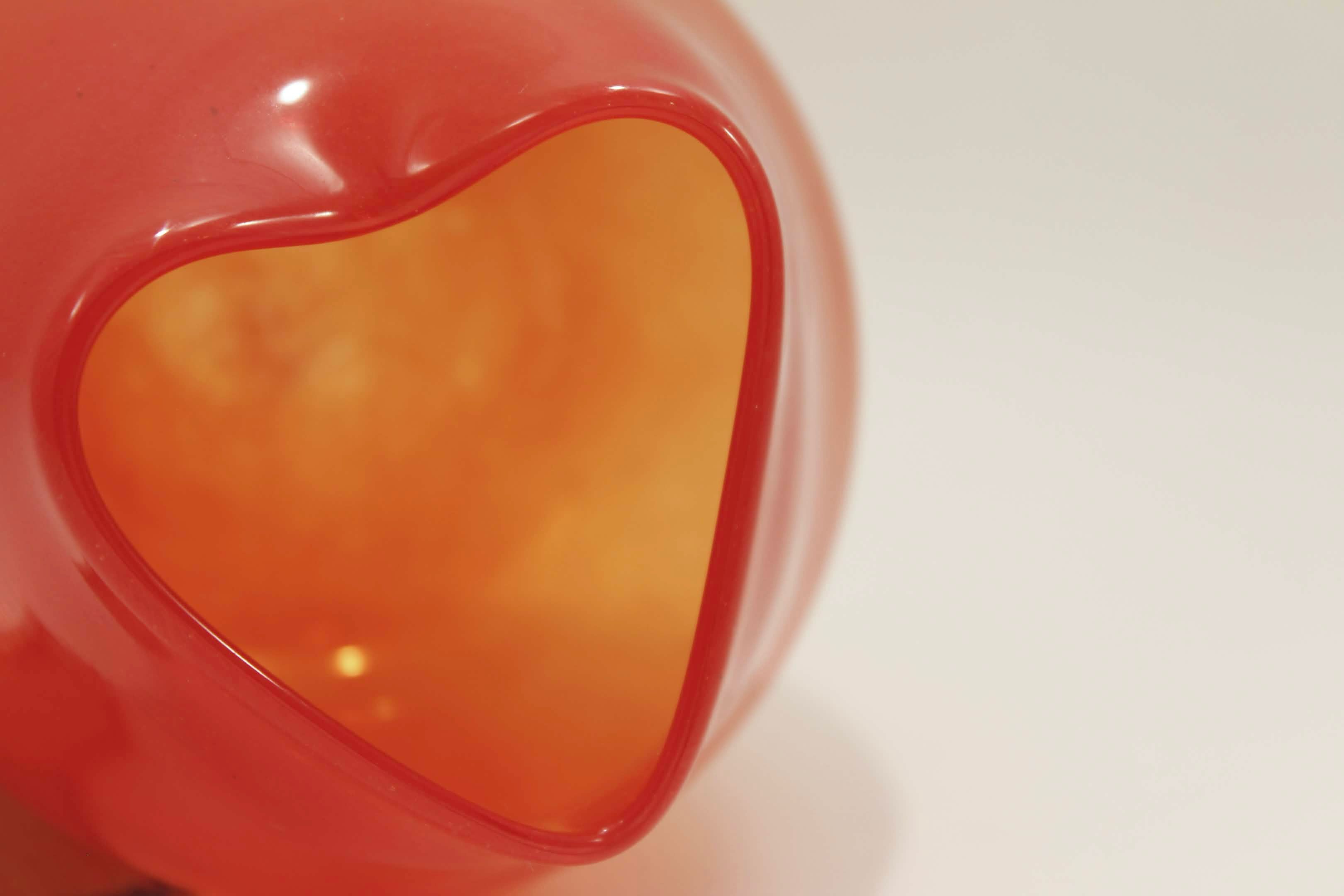 Close-up of an orange glass heart-shaped object