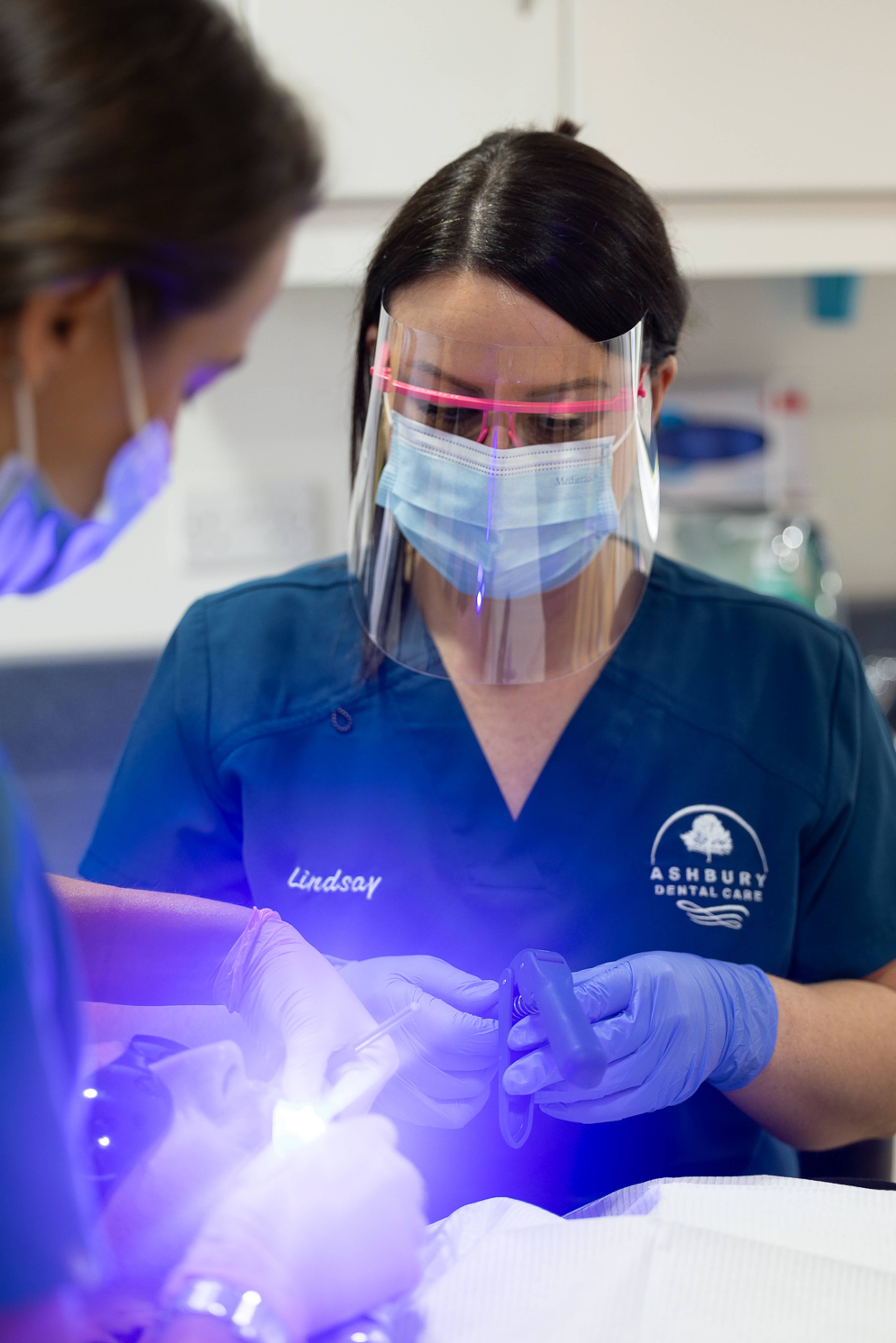 image of dentist performing cosmetic dentistry in devon