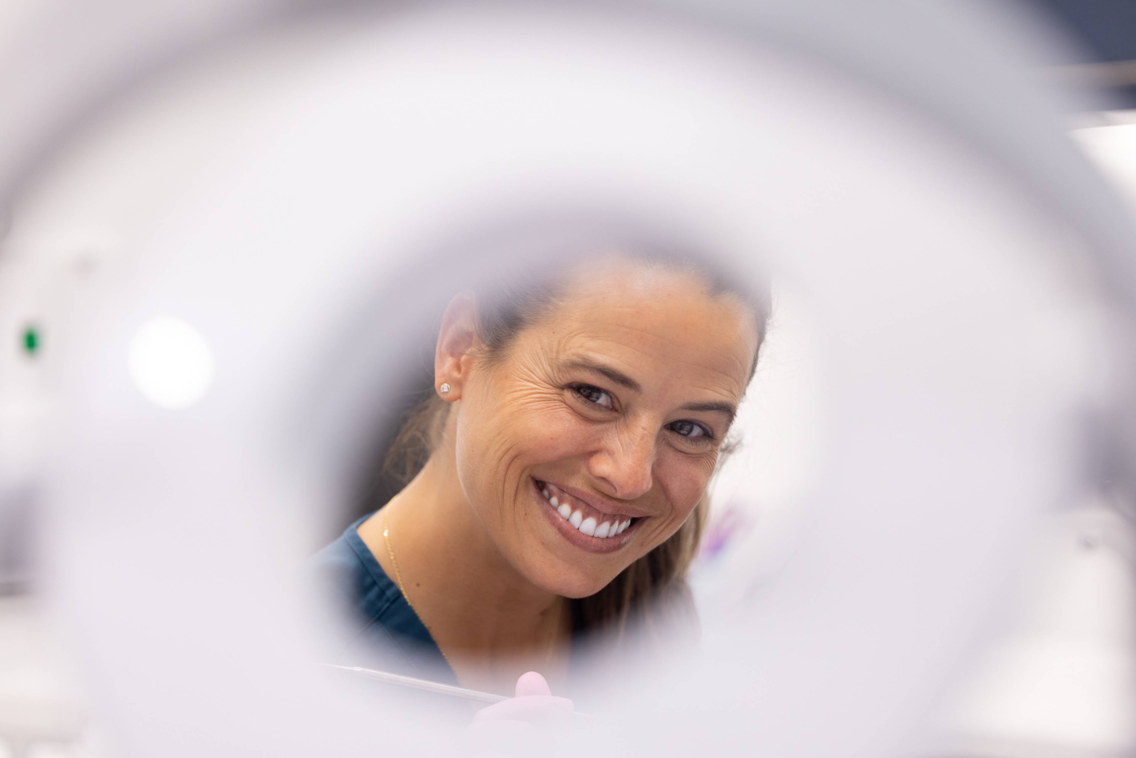 Smiling dentist with out-of-focus foreground