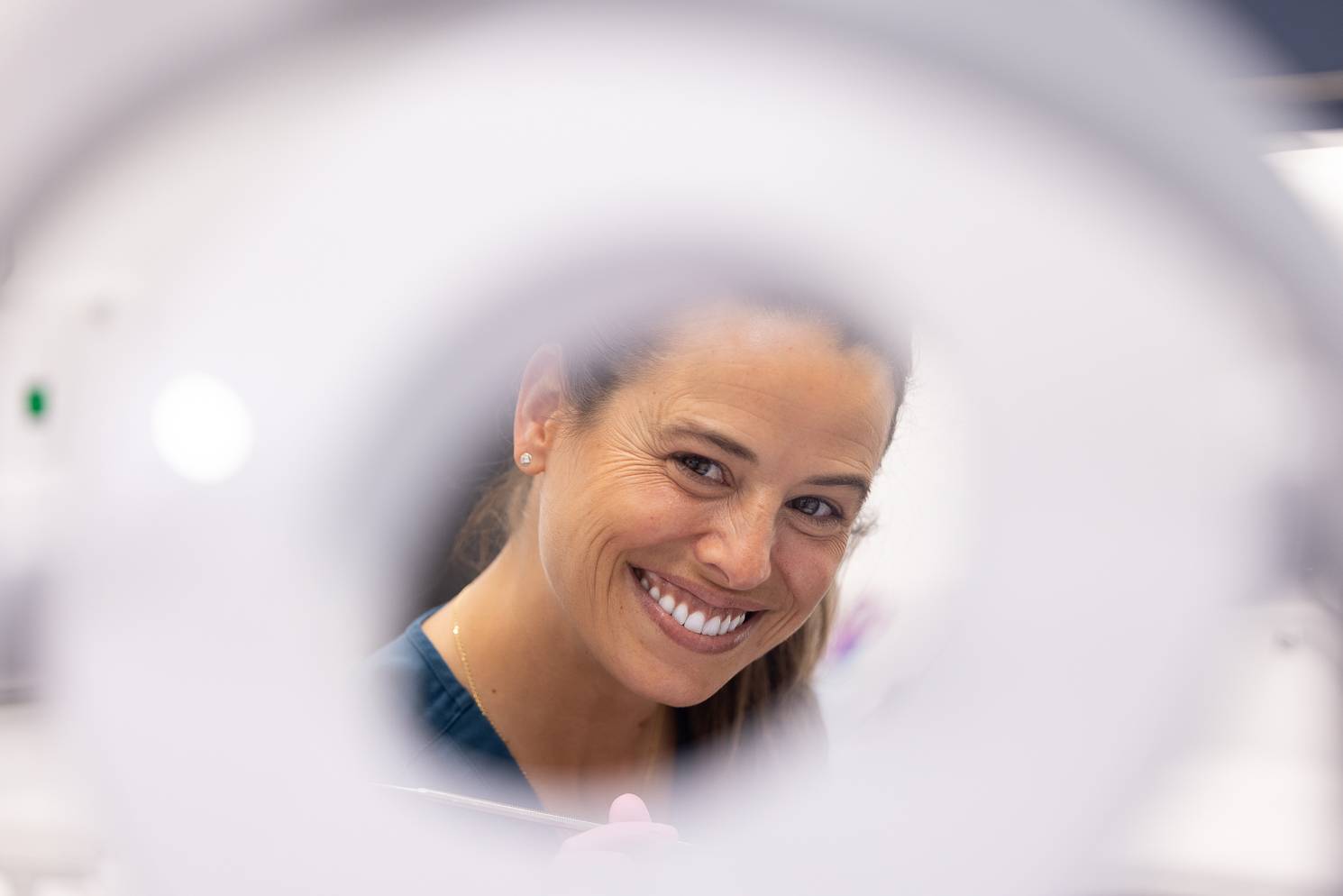 Smiling dentist with out-of-focus foreground