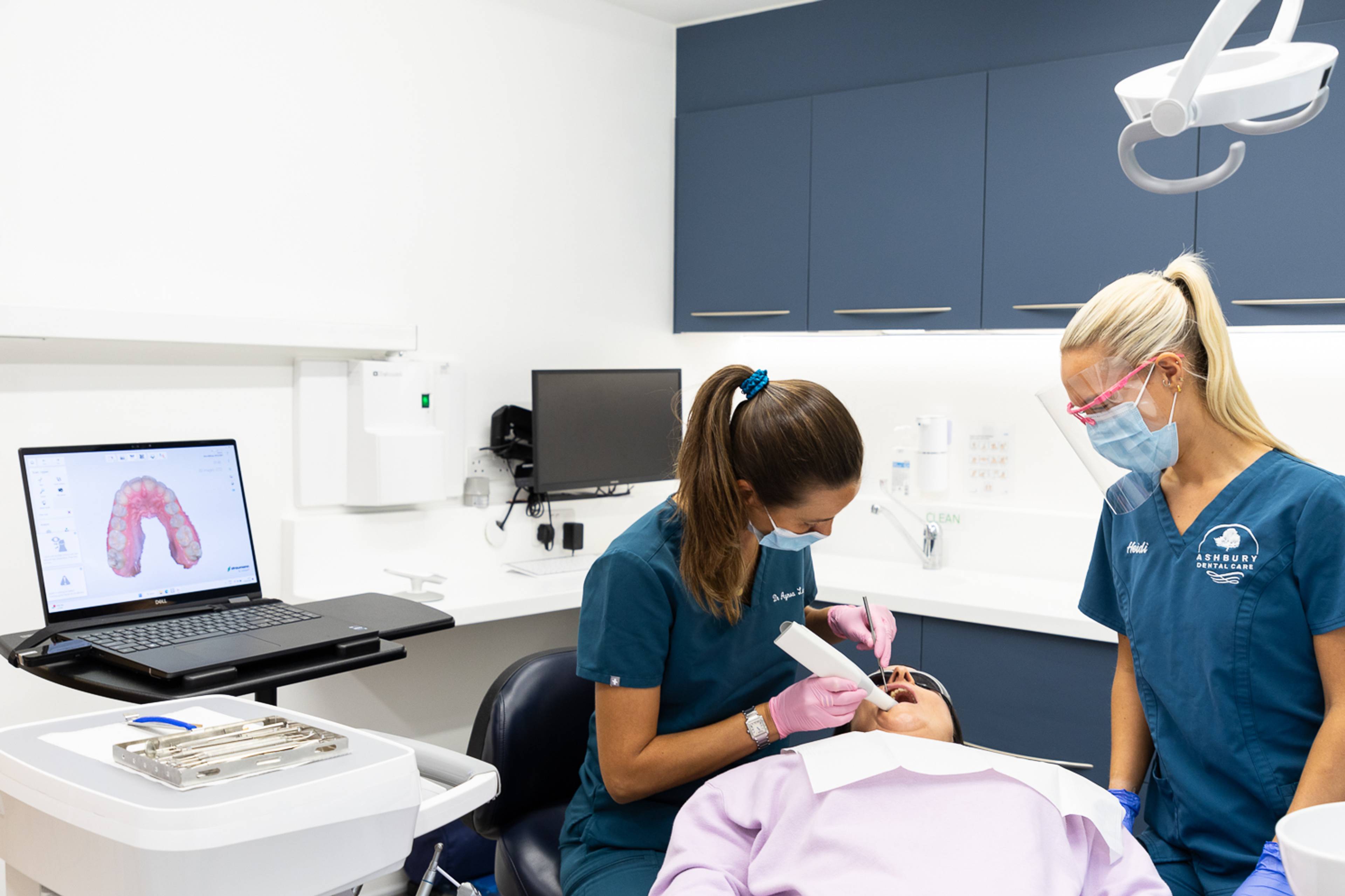 Patient being scanned for clear aligners by a dentist and dental nurse at Ashbury Dental Care