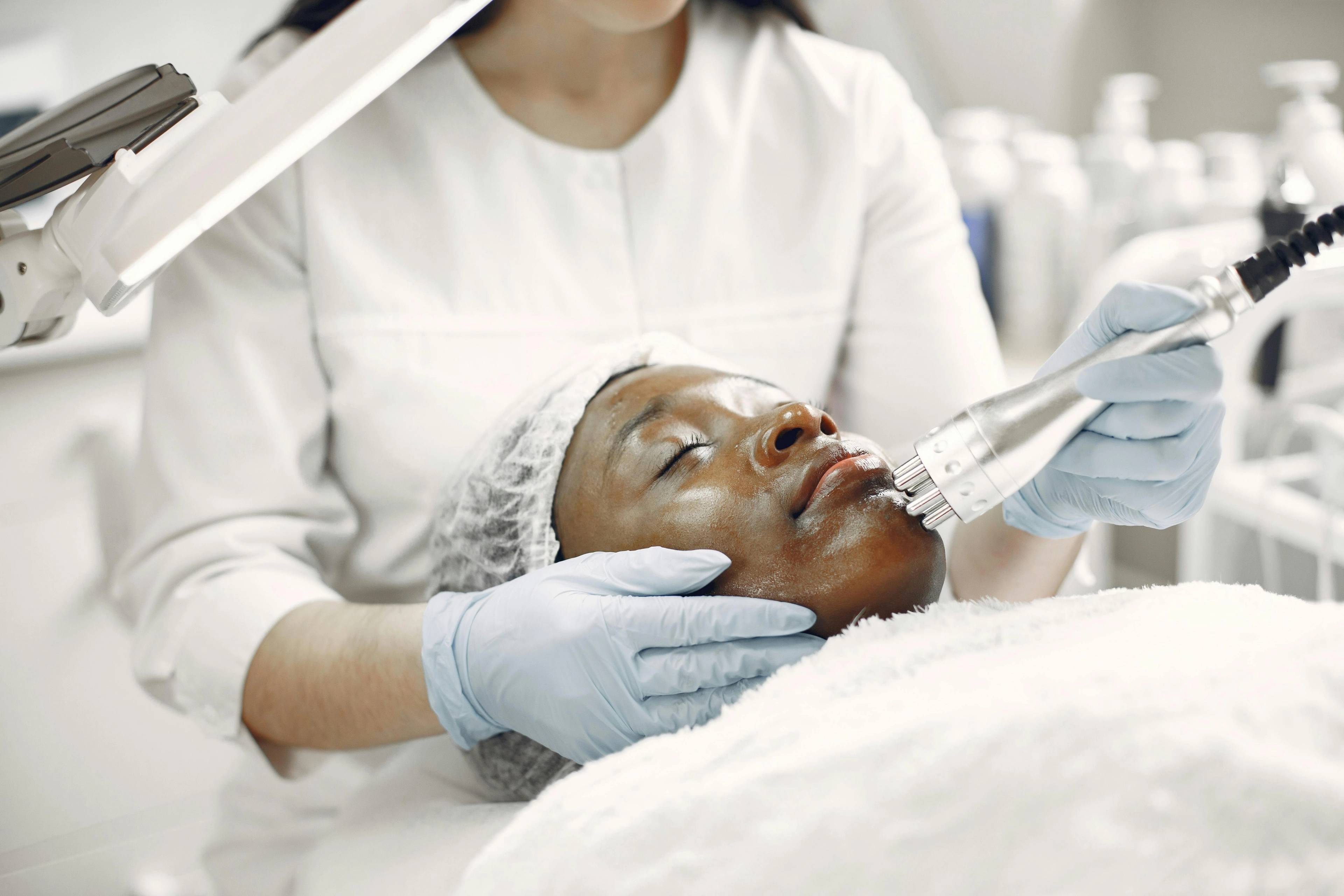 A dermal filler patient receiving treatment in a well-lit room