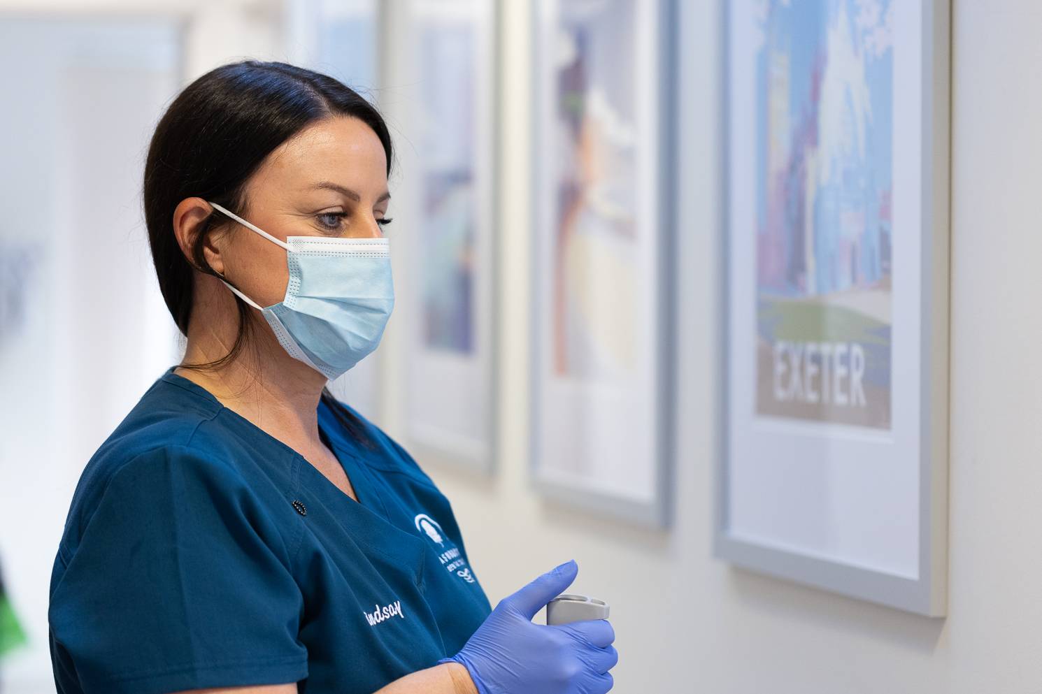 A dentist taking an xray of a patient's teeth