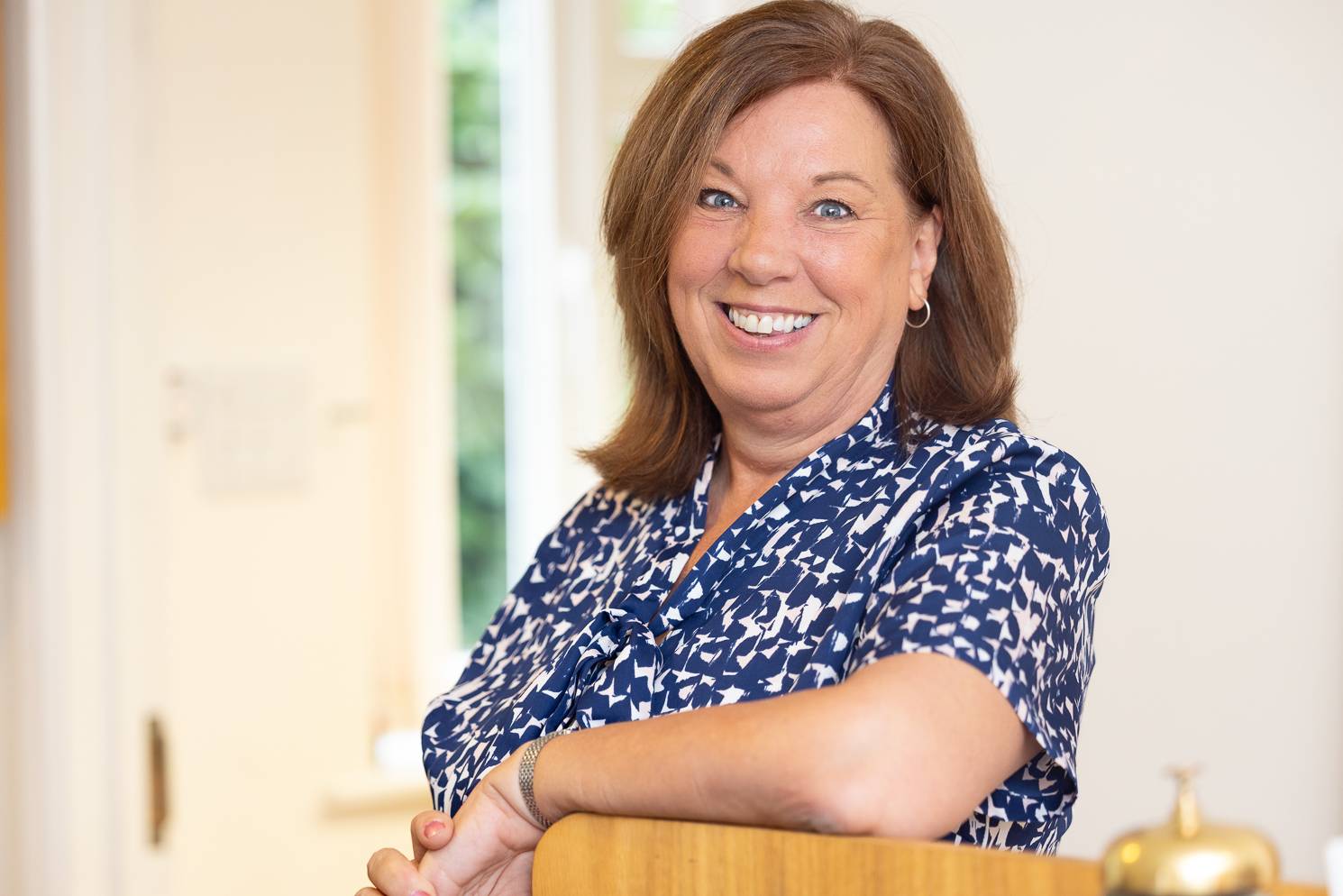 Smiling dentist with out-of-focus foreground