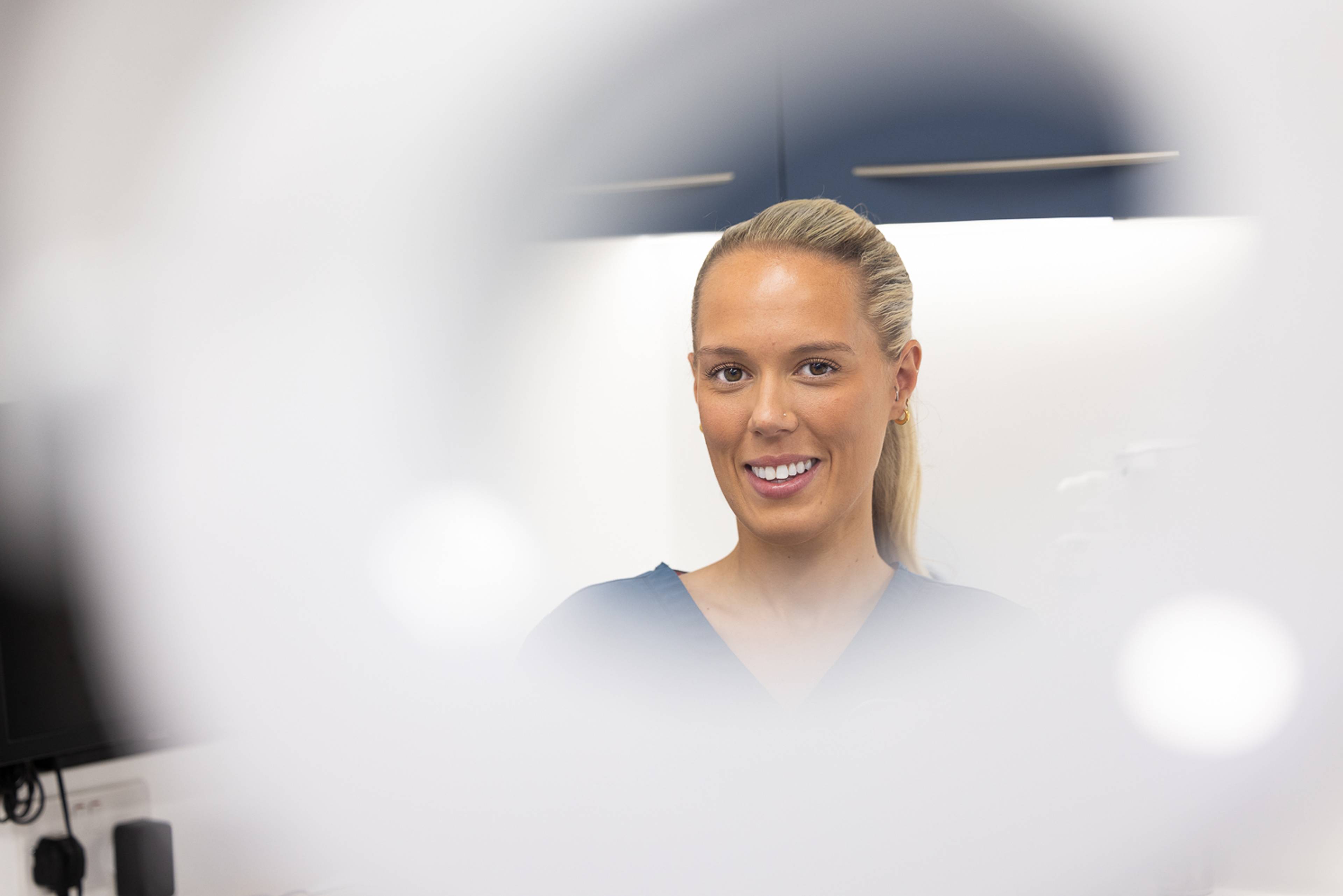A smiling member of the dental staff at Ashbury Dental Practice