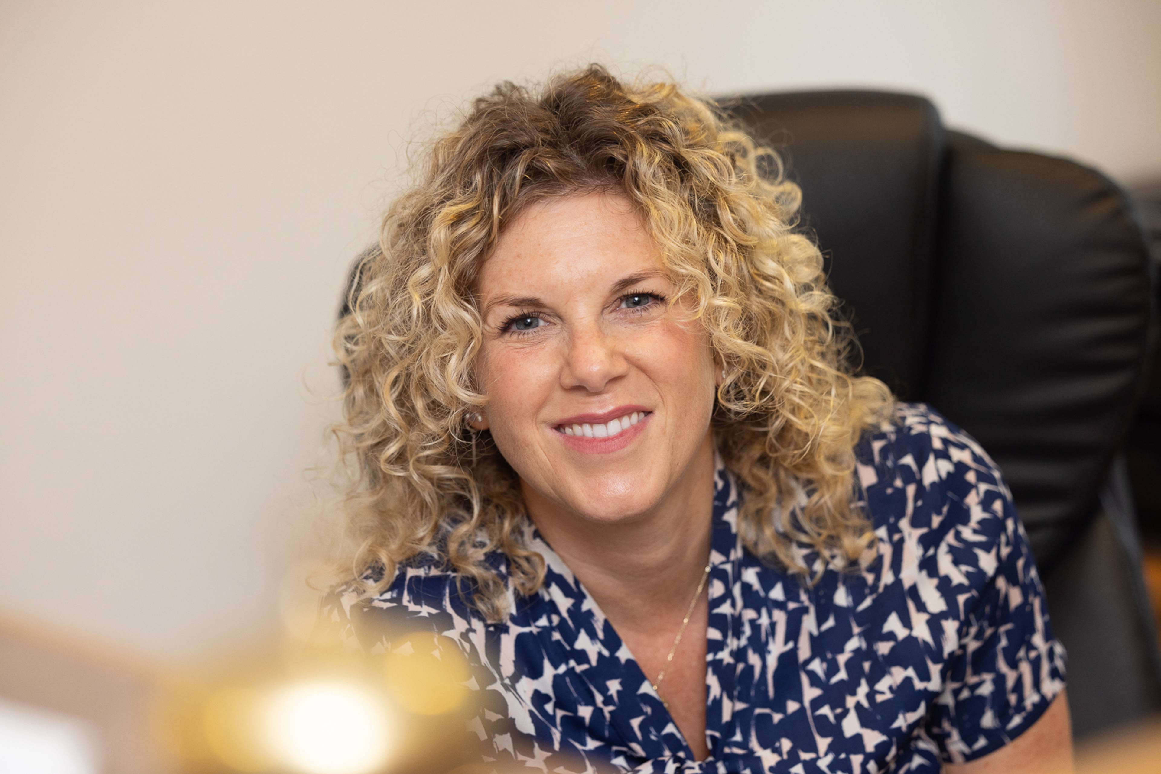 Receptionist at Ashbury Dental Care smiling in a welcoming way