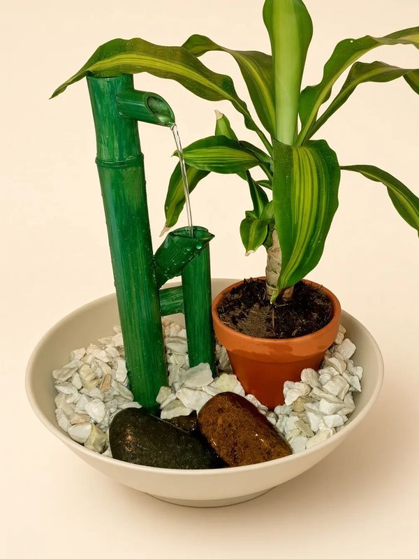 Péndulo verde con palo de agua