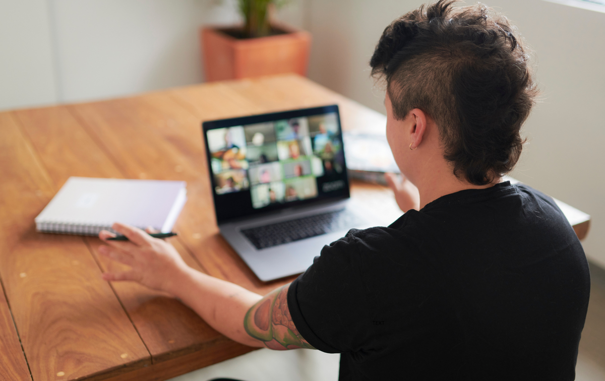 A small business owner uses remote workforce technology to provide seamless customer service from a home office