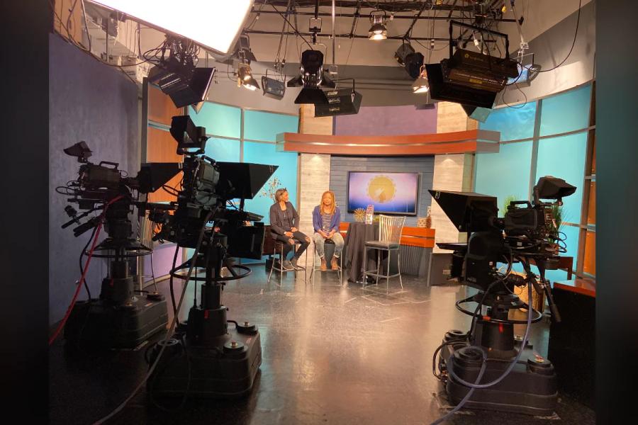 Raasin McIntosh in a TV studio interview during a Raasin in the Sun production