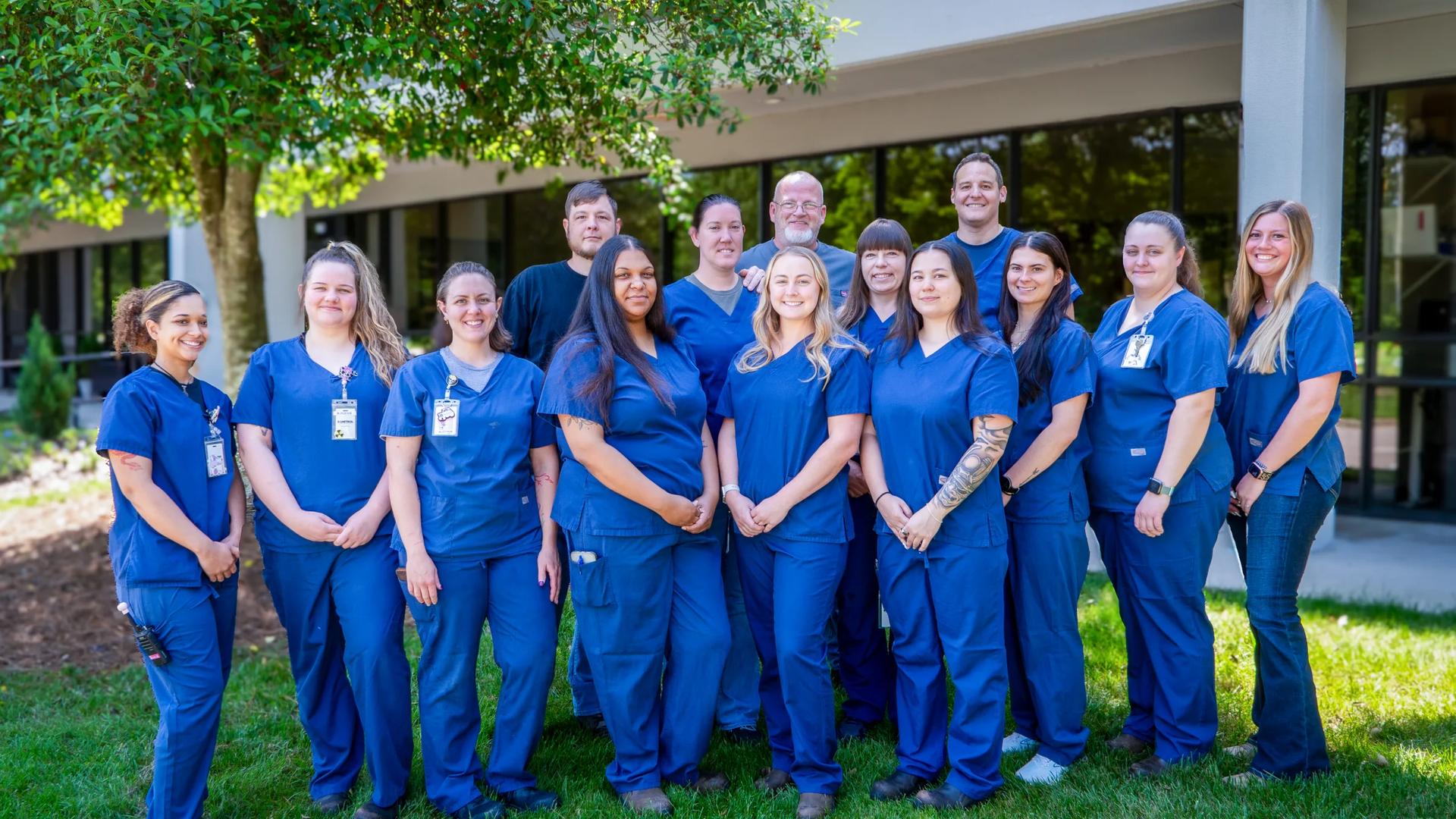 The Synchrony Labs team outside the facility