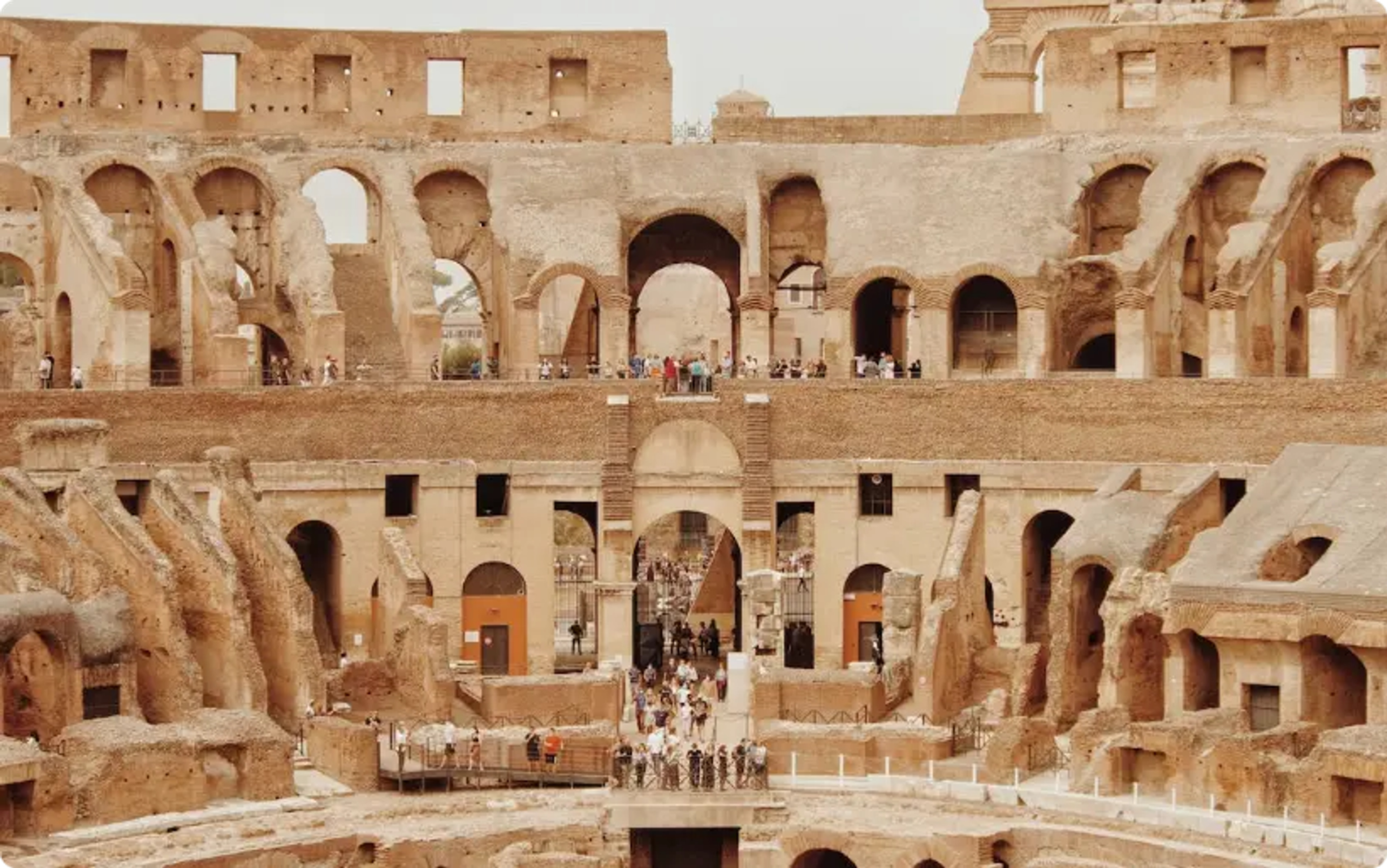 Interior view of the Colosseum in Rome, showing multiple levels and arched openings