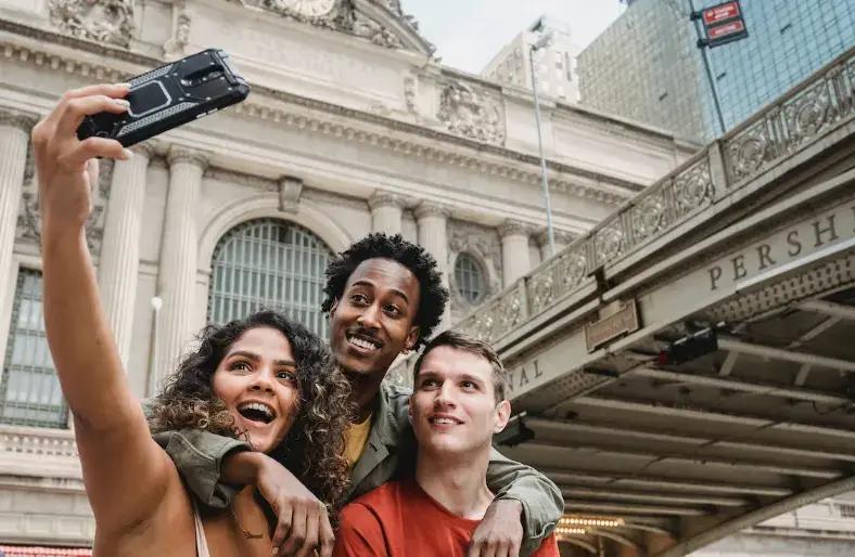 tour guide taking selfie with tourists