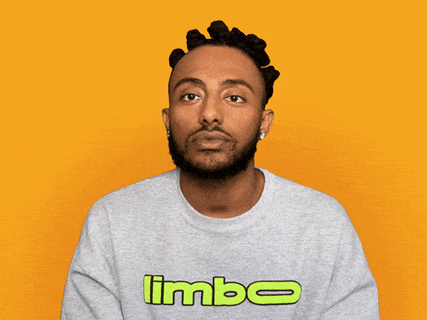 Person in gray sweatshirt with 'limbo' text against bright yellow background