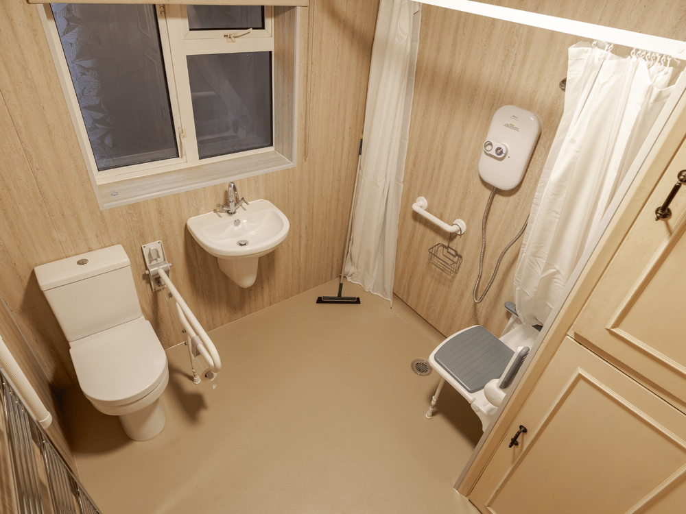 A level-access shower room fitted for a council housing adaptation