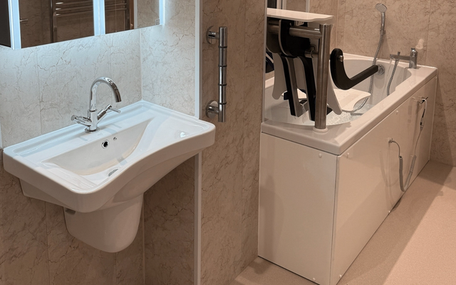 A bespoke wheelchair-accessible bathroom designed with an OT