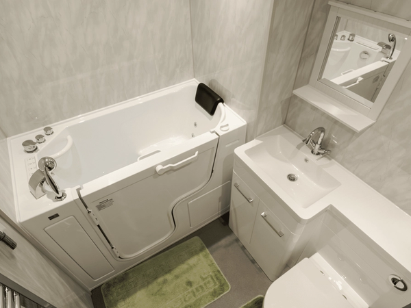 A walk-in bath with a low-level entry door