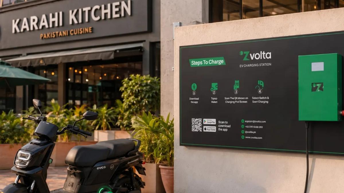 A Zvolta wall charger outside a restaurant, with an electric scooter parked in front