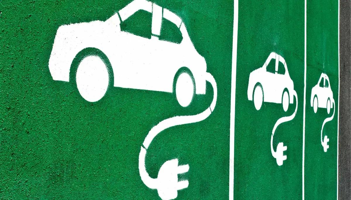 EV charging bays painted green with white car and plug symbols