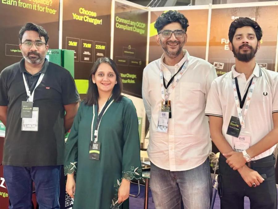 The Zvolta team at their stand, with 3 kW, 7 kW and 22 kW chargers behind them