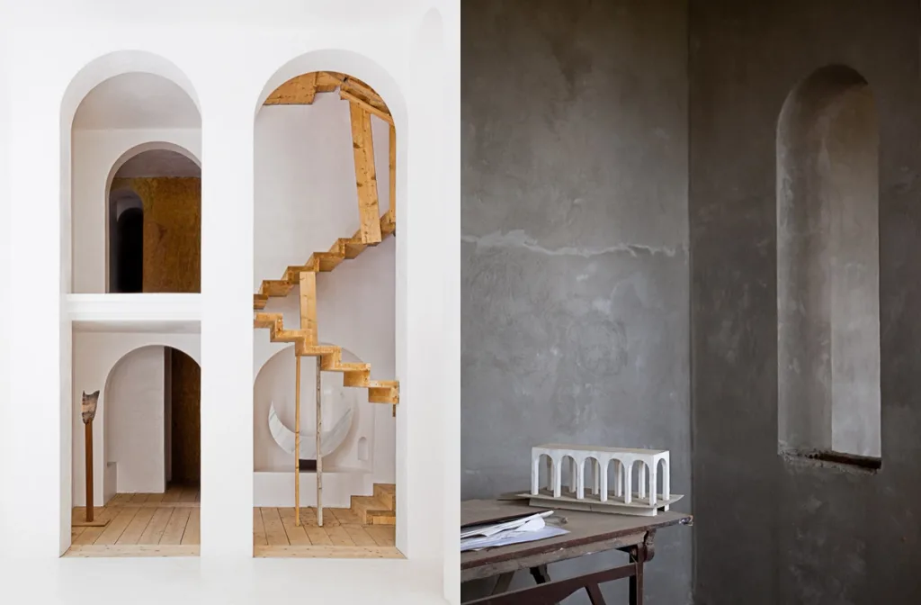 White arches and wooden stairs paired with an architectural model, Xavier Corbero series
