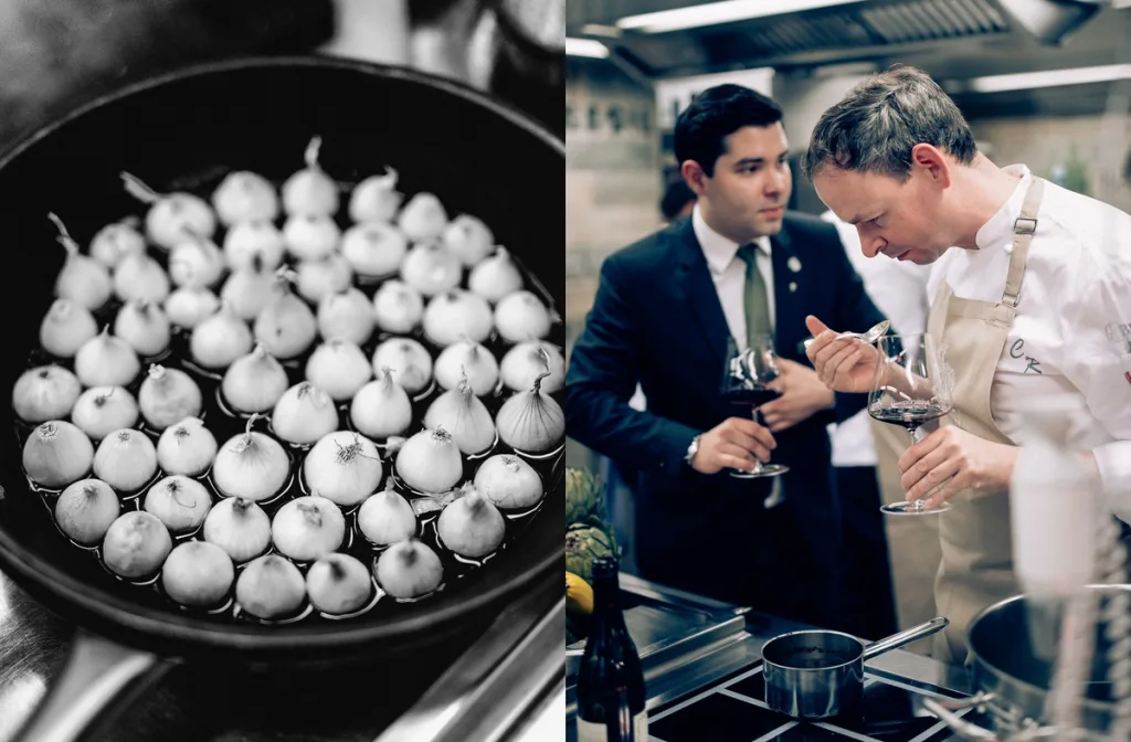 Pan of small onions beside a chef and sommelier tasting in the kitchen, Fairmont Hotel, Hamburg
