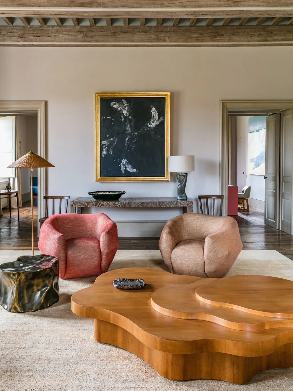 Rounded armchairs and a layered freeform coffee table at Fabrègues, Pierre Yovanovitch