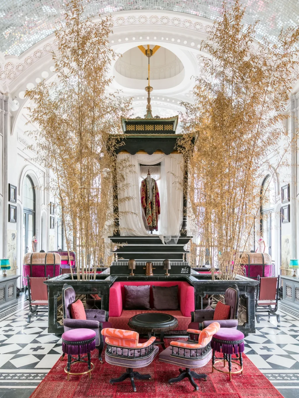 Dried bamboo stalks rise around a canopied display in a mirrored-domed hall, Hotel de la Coupole MGallery, Sapa, Vietnam