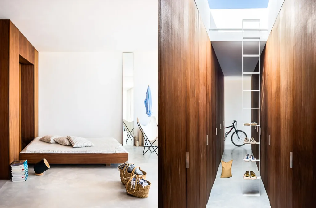 Low bed paired with a skylit wooden corridor and tall shoe rack at Casa Formentera, Marià Castello