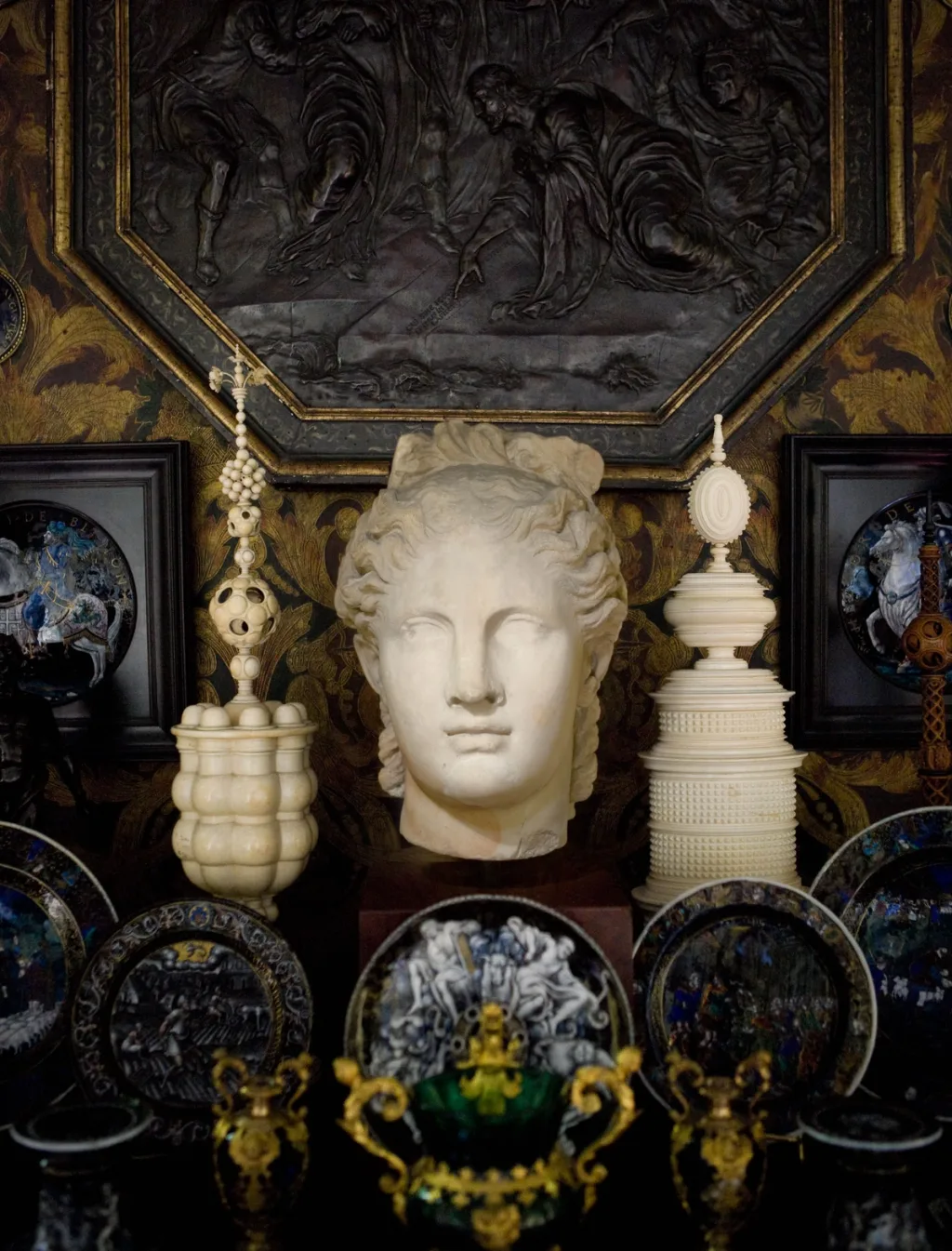 White sculpted head among elaborate vessels and decorative plates, Pierre Bergé, Paris
