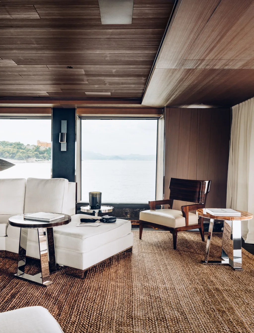White lounge seating beneath a wood ceiling in Atlante's Gilles et Boissier interior