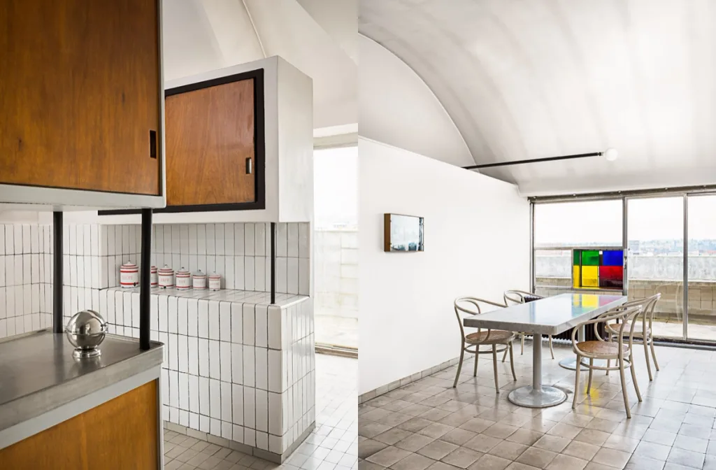 Tiled kitchen with wooden cupboards paired with the vaulted dining area at Atelier Le Corbusier