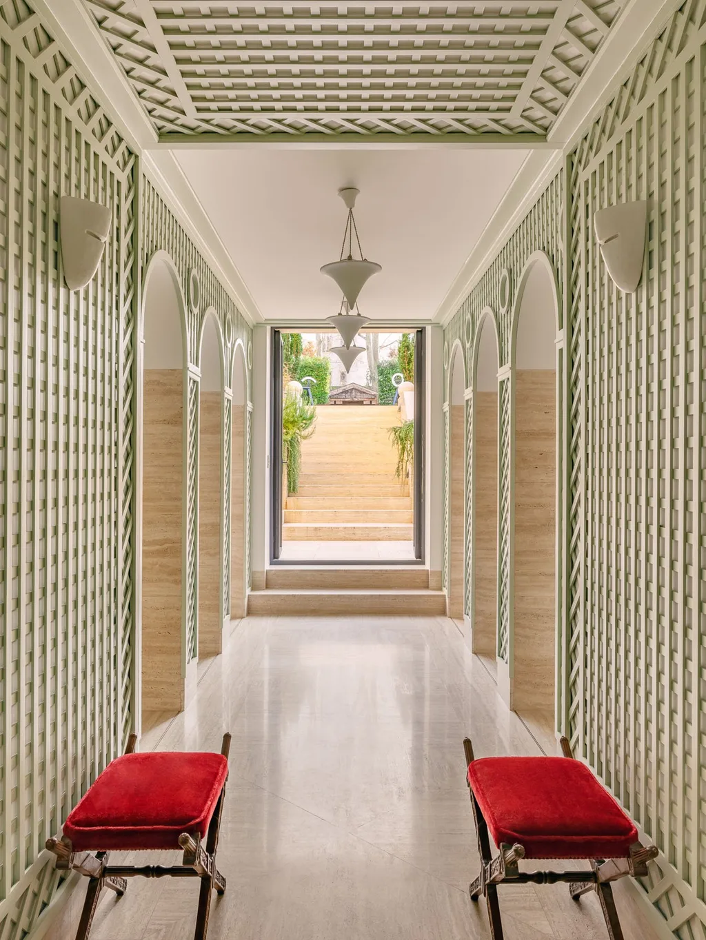 Green lattice corridor with arched mirrors in Laurent Buttazzoni's Paris interior