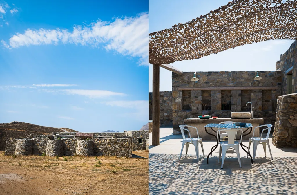 Low stone buildings in a dry landscape paired with a shaded outdoor dining area in Serifos