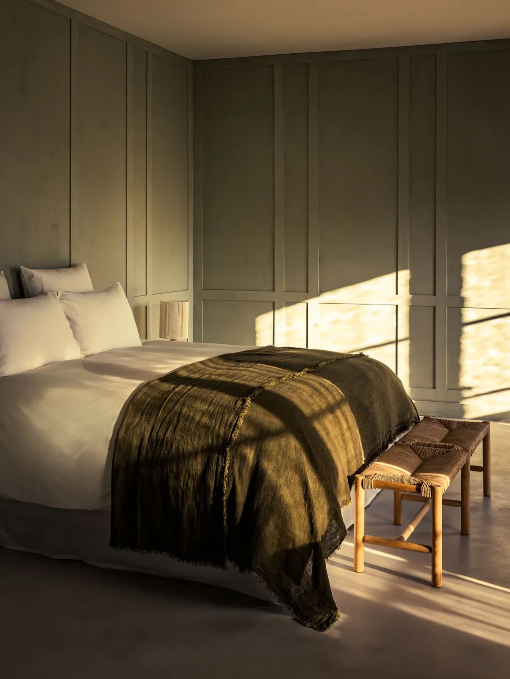 Morning light casts window shadows across the bed, Manufacture Royale de Lectoure hotel