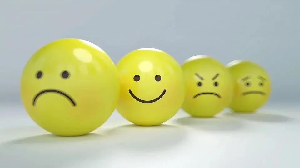 Smiling and frowning game pieces arranged together