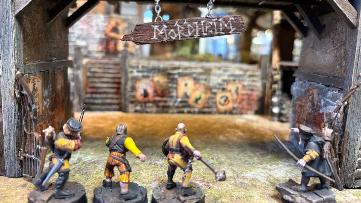 A band of Mordheim adventurers approaches a ruined city.