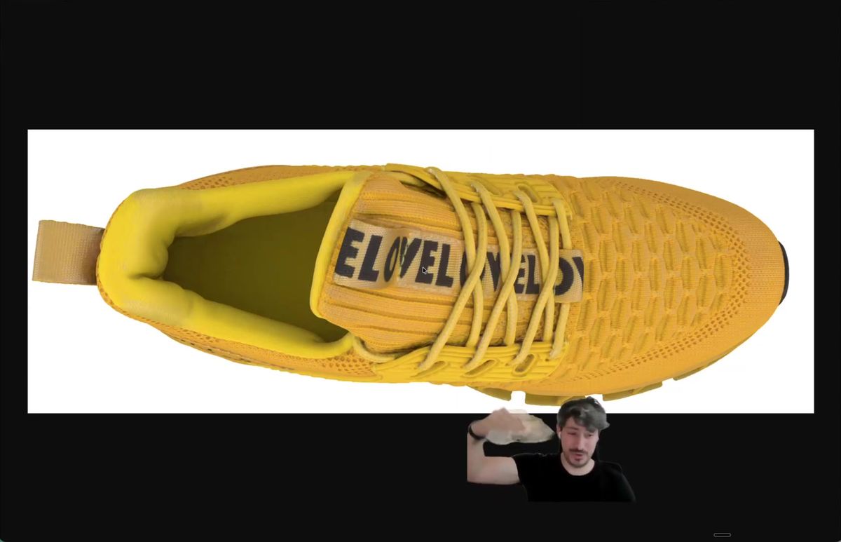 The flipped E LOVE text on the AI generated shoe, the error that makes the shot unusable